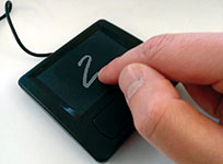 AIfES demonstrator for handwriting recognition. Numbers written by hand on the PS/2 touchpad are identified and output by the microcontroller. 